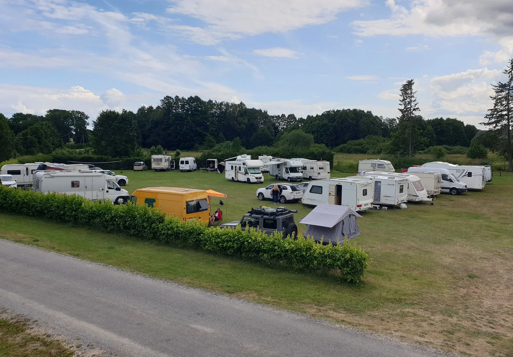 Caravans and motorhomes by the road in the caravan park