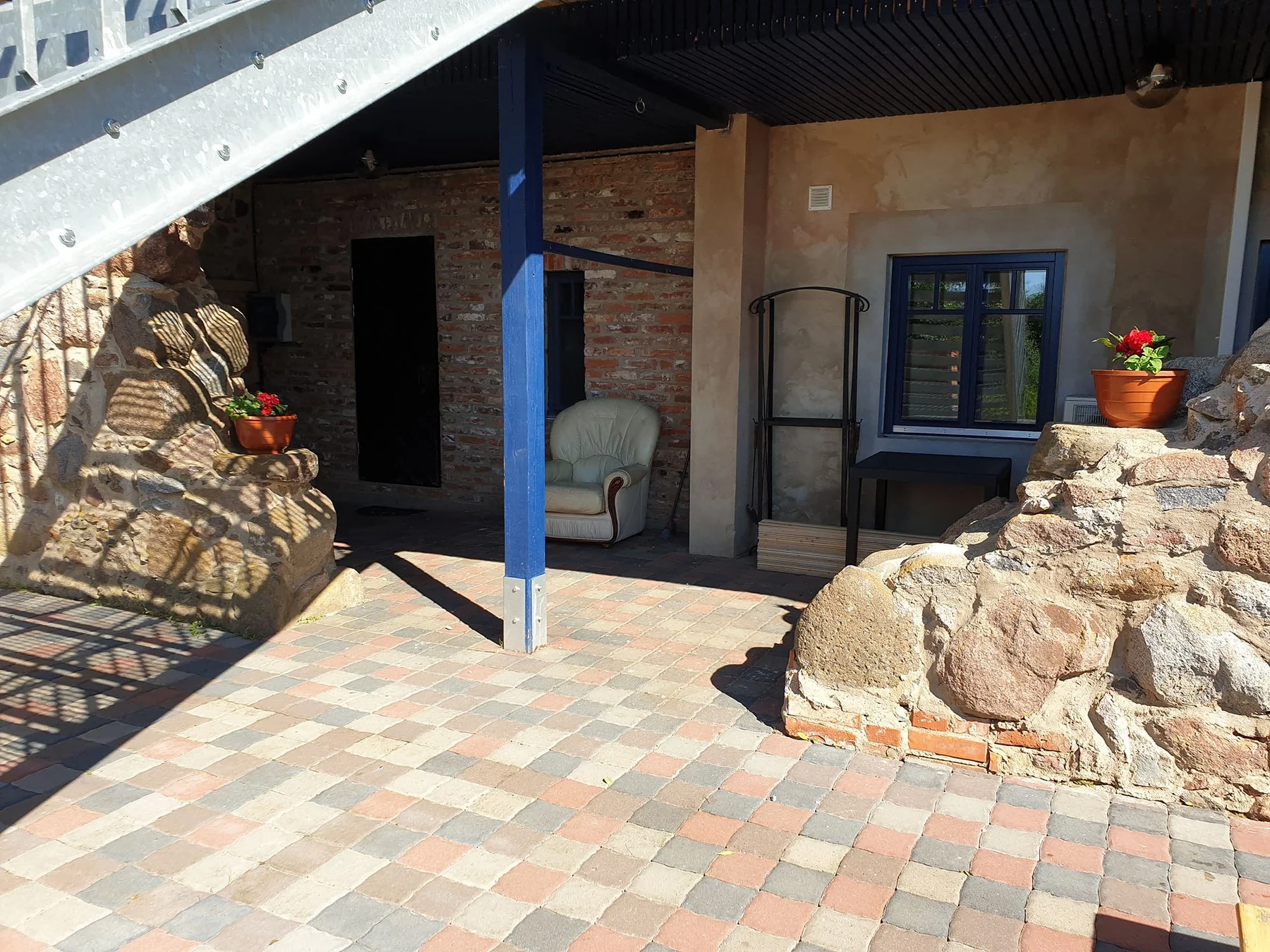 Covered terrace with a barbecue corner