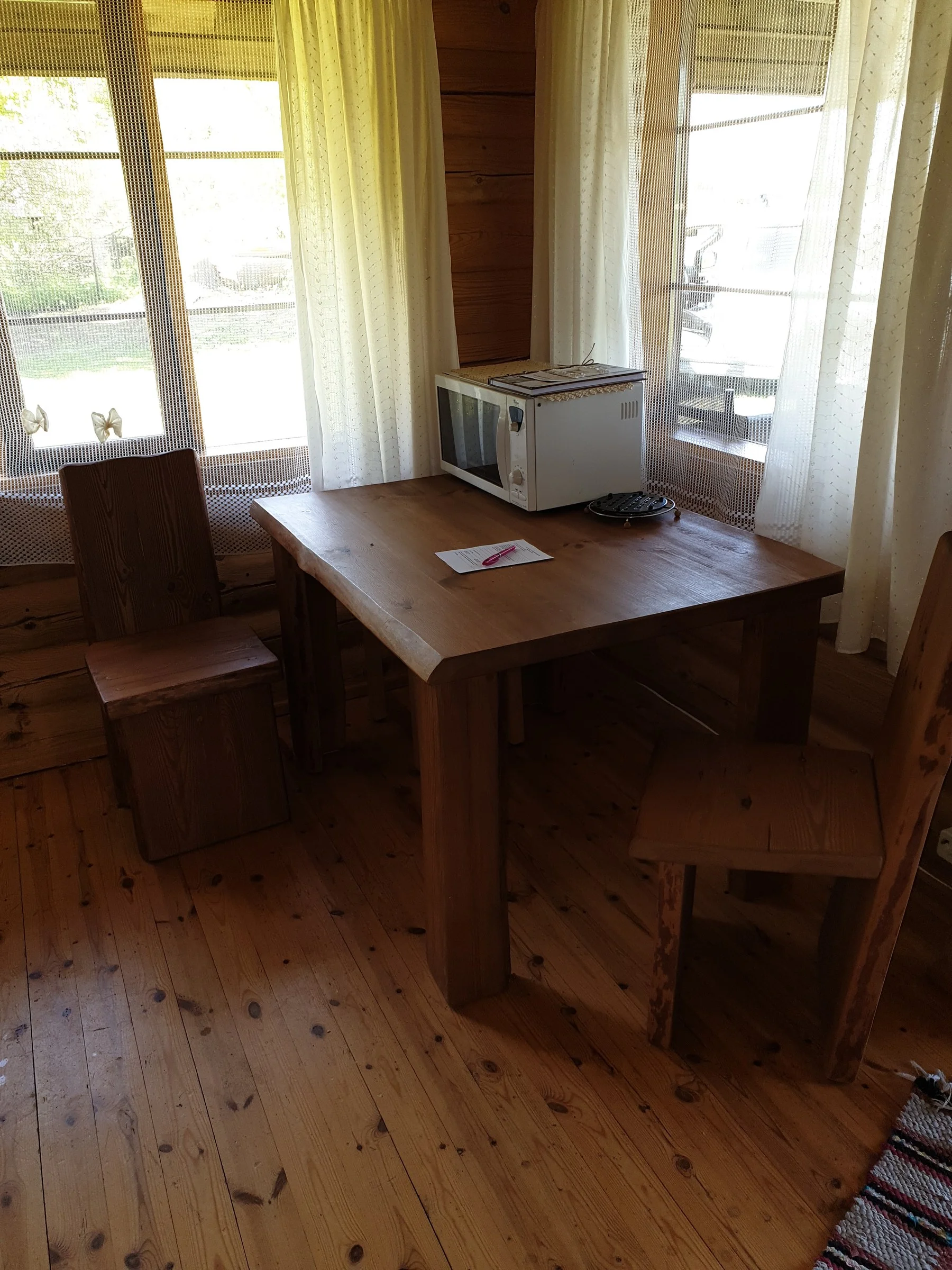Dining table by the window with a toaster