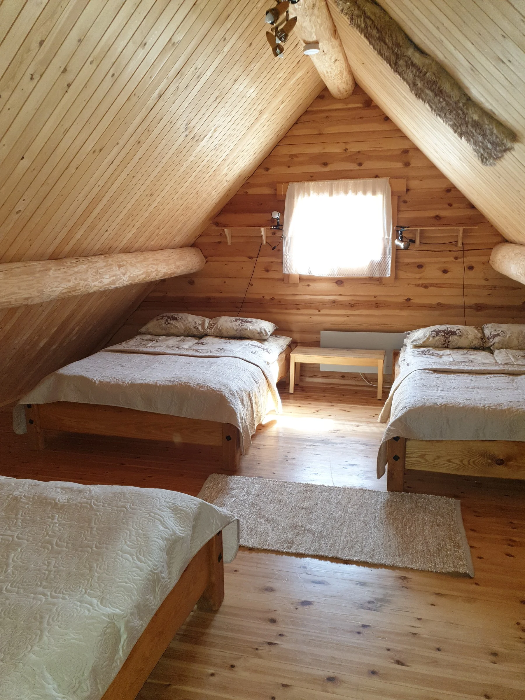 Bedroom with three beds upstairs