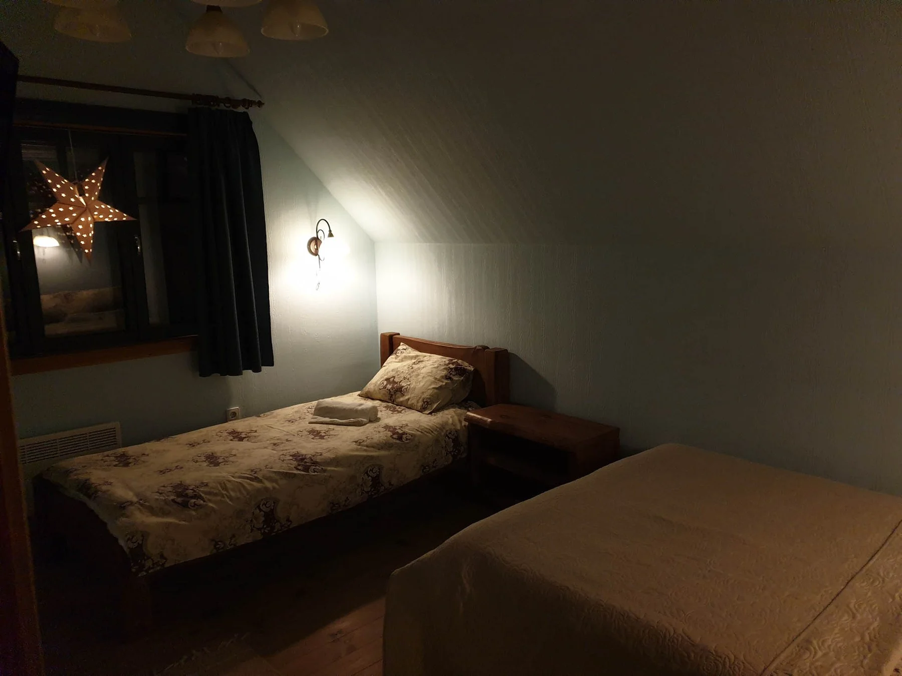Bedroom with a double bed and a single bed