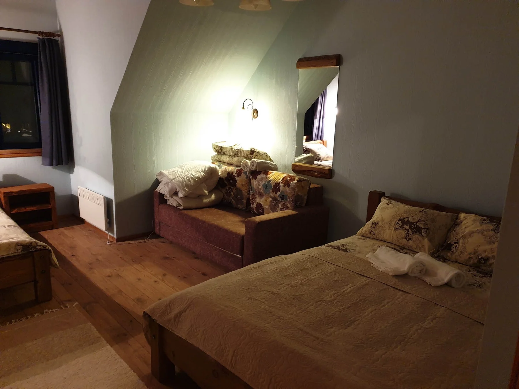 Bedroom with a bed and a mirror